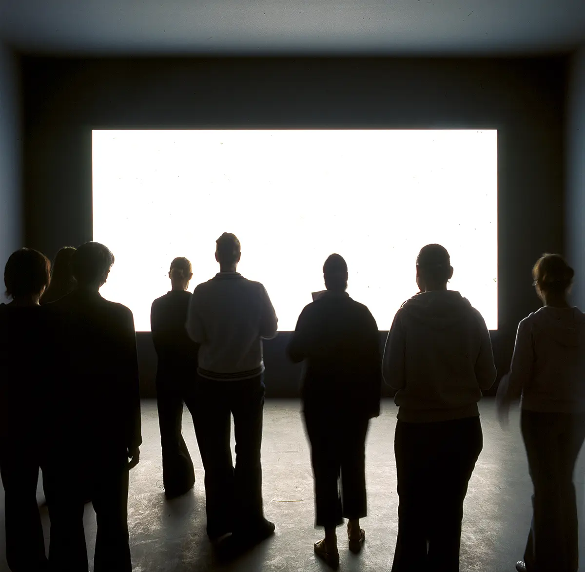 Alfredo Jaar. Lament of the Images, 2002. Installation with three light texts inserted into a wall, two corridors and blinding white light.